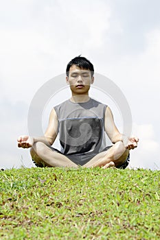 Asian Man meditating