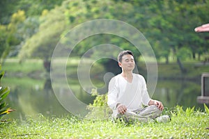 Asian Man Meditating photo