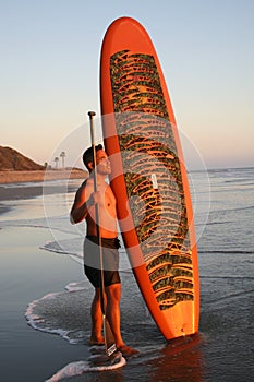 Asian Man with Paddleboard photo