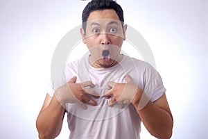 Asian Man Pointing Himself with Unhappy Expression as if he confused to be accused