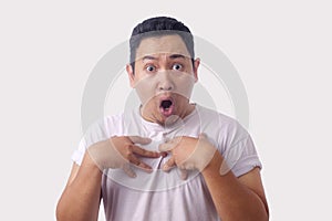 Asian Man Pointing Himself with Unhappy Expression as if he confused to be accused