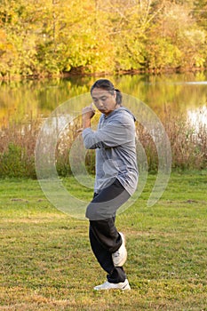 Asian man practicing tai chi