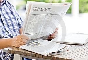 Asian Man Reading The Financial Newspaper.