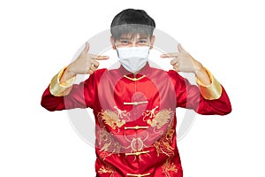 Asian man in red mandarin collar dress wearing Anti virus mask isolated on white background with clipping path. Chinese new year