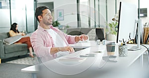 Asian man, relax and typing on computer in modern office for copywriting, planning strategy or online report success