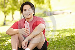 Asian man resting after exercise