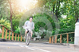 Asian man riding a bicycle for relaxation