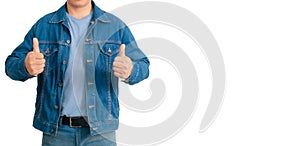 Asian man in shirt and jeans