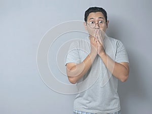 Asian Man Shocked and Closing his Mouth