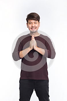 Asian man smile and greeting by Thai traditional respect, Sawatdee, isolated on white background