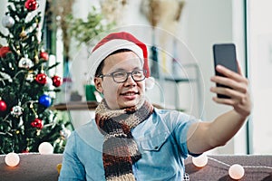 Asian man smile and take selfie photo with mobile phone with bl