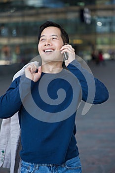 Asian man smiling with cellphone