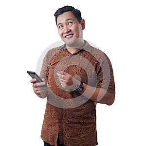 Asian Man Smiling While Holding Credit Card