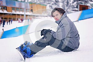 Asian man snowboarding