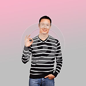 Asian Man In Striped Pullover