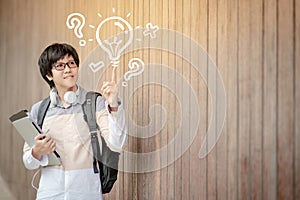 Asian man student pointing at light bulb