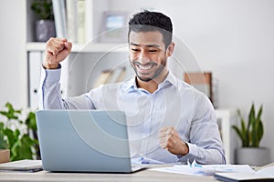 Asian man, success fist and laptop by desk with happy, stock market deal and investment portfolio growth in office