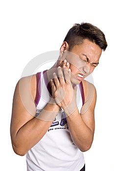 Asian man suffering from painful toothache,