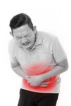 Asian man suffering from stomachache, constipation, indigestion photo