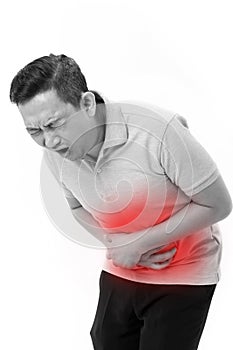 asian man suffering from stomachache, constipation, indigestion, digestive problem photo