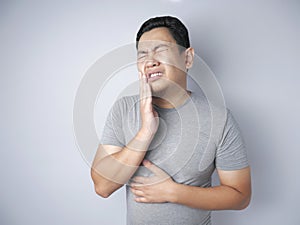 Asian Man Suffering Toothache Pain