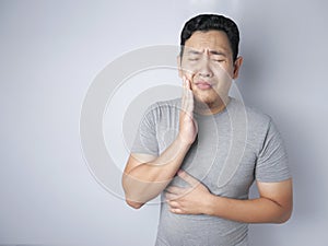 Asian Man Suffering Toothache Pain