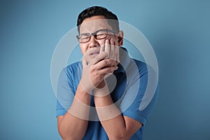 Asian Man Suffering Toothache Pain