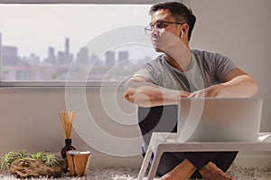 Asian man take a break from social and enjoy himself at quiet space corner