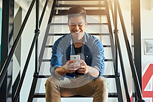 Asian man, texting and office stairs with phone, smile and communication on social network app. Young japanese