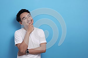 Asian man thinking something, looking for good idea