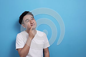 Asian man thinking something, looking for good idea