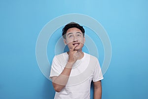 Asian man thinking something, looking for good idea