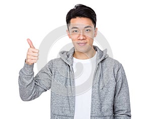 Asian man with thumb up