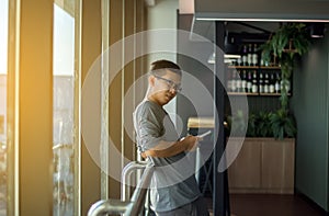 Asian man traveler using mobile phone internet and wifi in airport, Lifestyle using cell phone connection concept