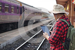 Asian man traveller is at railway station