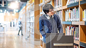 Asian man university student in college library