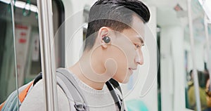Asian man wear wireless earbuds photo