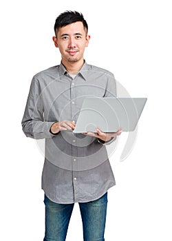 Asian man using laptop computer