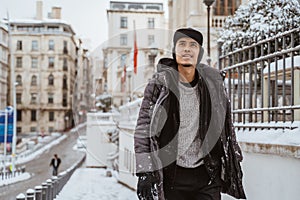 asian man walking in historical old town in istanbul