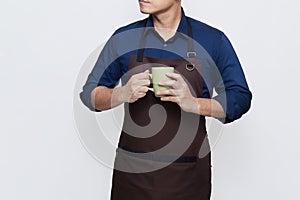 Asian Man wearing Apron holding a glass of drink, calm and confident gesture