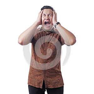 Asian Man Wearing Batik Shirt Crying Hard