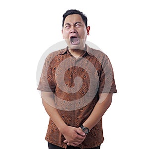 Asian Man Wearing Batik Shirt Crying Hard