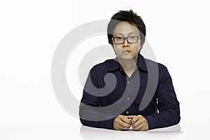 Asian man wearing casual blue shirt with glasses