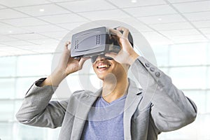 asian man wearing virtual reality goggle