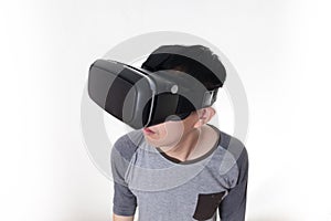 Asian man wearing VR goggle and immersing himself in VR multimedia