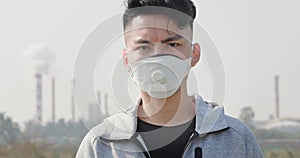 Asian man wears protective mask