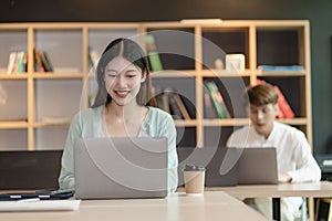 Asian man and woman meeting Asian Business Consultants to analyze and discuss financial report