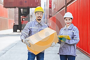 Asian man and women team workers customs staff teamwork in container yard port shipping cargo logistics industry