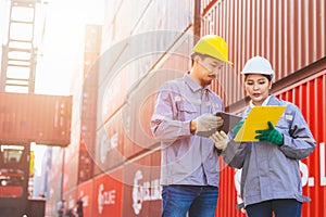 Asian man and women team workers customs staff teamwork in container yard port shipping cargo logistics industry