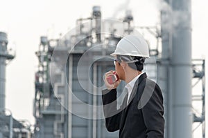 Asian man worker and engineer electrician work safety control at power plant energy industry,